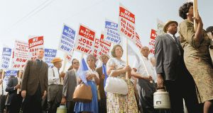 Black people protesting holding signs